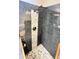 Walk-in shower with pebble tile and rain shower head at 790 Pine Shores Cir, New Smyrna Beach, FL 32168