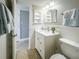 White vanity with a toilet and shower in a clean bathroom at 2401 S Atlantic Ave # D304, New Smyrna Beach, FL 32169