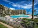 Inviting pool area with lounge chairs and ocean views at 2401 S Atlantic Ave # D304, New Smyrna Beach, FL 32169