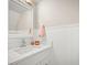 Clean bathroom with white vanity and shiplap walls at 2401 S Atlantic Ave # D304, New Smyrna Beach, FL 32169