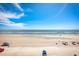 Expansive beach view with clear skies and people enjoying the sand at 2401 S Atlantic Ave # D304, New Smyrna Beach, FL 32169