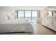 Ocean view bedroom with king-size bed and white dresser at 2401 S Atlantic Ave # D304, New Smyrna Beach, FL 32169