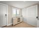 Entryway with white console table and sliding doors at 2401 S Atlantic Ave # D304, New Smyrna Beach, FL 32169