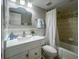 Clean bathroom with white vanity, bathtub, and shower at 2401 S Atlantic Ave # D304, New Smyrna Beach, FL 32169