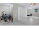 Bedroom with tiled floor, ceiling fan, and access to other rooms at 6368 S Atlantic Ave, New Smyrna Beach, FL 32169