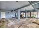 Covered parking area under the house with concrete floor and exterior access at 6368 S Atlantic Ave, New Smyrna Beach, FL 32169