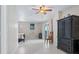 Bedroom with tiled floors, ceiling fan, and a built-in wardrobe at 6368 S Atlantic Ave, New Smyrna Beach, FL 32169