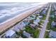 Aerial view of oceanfront homes and street at 6368 S Atlantic Ave, New Smyrna Beach, FL 32169