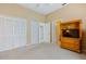 Bedroom with double closets and access to hallway at 6368 S Atlantic Ave, New Smyrna Beach, FL 32169