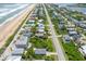Aerial view of beachfront homes and street at 6368 S Atlantic Ave, New Smyrna Beach, FL 32169