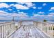 Oceanfront deck with wooden planks offering stunning ocean views at 6368 S Atlantic Ave, New Smyrna Beach, FL 32169