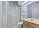Bathroom with shower, vanity, and toilet at 6368 S Atlantic Ave, New Smyrna Beach, FL 32169