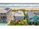 Aerial view of beach house and surrounding area, including pool at 6368 S Atlantic Ave, New Smyrna Beach, FL 32169