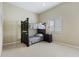 Bedroom with bunk bed, nightstand, and window at 6368 S Atlantic Ave, New Smyrna Beach, FL 32169