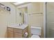 Bathroom features a vanity, toilet and shower at 6368 S Atlantic Ave, New Smyrna Beach, FL 32169