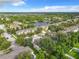 Community overview showcasing a lake, homes, and lush landscaping at 521 Mount Olympus Blvd, New Smyrna Beach, FL 32168