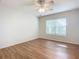 Bright bedroom with wood flooring and ceiling fan at 521 Mount Olympus Blvd, New Smyrna Beach, FL 32168