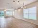 Open living room featuring tile flooring and lots of natural light at 521 Mount Olympus Blvd, New Smyrna Beach, FL 32168