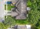 Top-down view of a house and surrounding landscape at 521 Mount Olympus Blvd, New Smyrna Beach, FL 32168