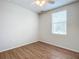 Spacious bedroom featuring wood floors and a large window at 521 Mount Olympus Blvd, New Smyrna Beach, FL 32168
