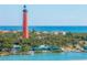 Lighthouse and coastal community oceanfront view at 51 Sun Dunes Cir, Ponce Inlet, FL 32127