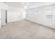 Large main bedroom with bathroom access and neutral carpet at 51 Sun Dunes Cir, Ponce Inlet, FL 32127
