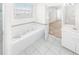 Relaxing bathroom with soaking tub, shower, and updated vanity at 51 Sun Dunes Cir, Ponce Inlet, FL 32127