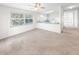 Open living room with kitchen views and a ceiling fan at 51 Sun Dunes Cir, Ponce Inlet, FL 32127
