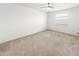 Spacious bedroom with carpeted floors and a ceiling fan at 51 Sun Dunes Cir, Ponce Inlet, FL 32127