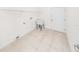 Laundry room with utility sink and overhead shelving at 51 Sun Dunes Cir, Ponce Inlet, FL 32127