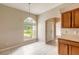 Eat in kitchen with wood cabinets and a large window at 117 Opal Hill Cir, Daytona Beach, FL 32124