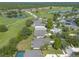 Community view, featuring houses, golf course, and pond at 117 Opal Hill Cir, Daytona Beach, FL 32124