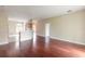 Spacious living room with hardwood floors and views into the kitchen at 117 Opal Hill Cir, Daytona Beach, FL 32124