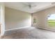 Large bedroom with neutral walls and plush carpeting at 117 Opal Hill Cir, Daytona Beach, FL 32124