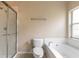 Bathroom with shower/tub combo, toilet and window at 117 Opal Hill Cir, Daytona Beach, FL 32124