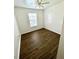 Spacious bedroom with wood-look floors and a ceiling fan at 2413 Victory Palm Dr, Edgewater, FL 32141