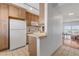 Kitchen boasts wood cabinets, white appliances, and ocean view at 1111 Hill St # U3, New Smyrna Beach, FL 32169