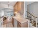 Kitchen with wood cabinets, white appliances, and ocean view at 1111 Hill St # U3, New Smyrna Beach, FL 32169