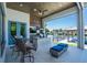 Outdoor kitchen and patio with water view at 113 Via Benevento, New Smyrna Beach, FL 32169