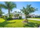 Single-story house with a large front yard and lush landscaping at 5321 Cordgrass Bend Ln, Port Orange, FL 32128