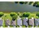 Bird's-eye view of houses near a canal, showcasing backyard and landscaping at 5321 Cordgrass Bend Ln, Port Orange, FL 32128