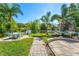 Backyard oasis with patio, pond view, and trampoline at 5321 Cordgrass Bend Ln, Port Orange, FL 32128