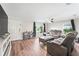 Bright living room featuring hardwood floors and a comfy seating area at 5321 Cordgrass Bend Ln, Port Orange, FL 32128