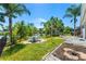 Spacious backyard with patio, pond view, and lush landscaping at 5321 Cordgrass Bend Ln, Port Orange, FL 32128