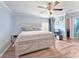 Main bedroom with ceiling fan and light grey walls at 5321 Cordgrass Bend Ln, Port Orange, FL 32128