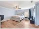 Main bedroom with ceiling fan and light grey walls at 5321 Cordgrass Bend Ln, Port Orange, FL 32128