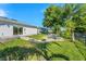 Landscaped backyard with patio and pond view at 5321 Cordgrass Bend Ln, Port Orange, FL 32128