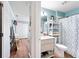 Shared bathroom with a toilet, shower, and a light vanity at 5321 Cordgrass Bend Ln, Port Orange, FL 32128
