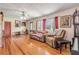 Relaxing living room with hardwood floors, comfy furniture, and natural light at 327 Due East St, New Smyrna Beach, FL 32169