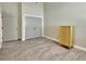 Simple bedroom with light walls, tile floors, and double door closet at 407 Douglas St, New Smyrna Beach, FL 32168